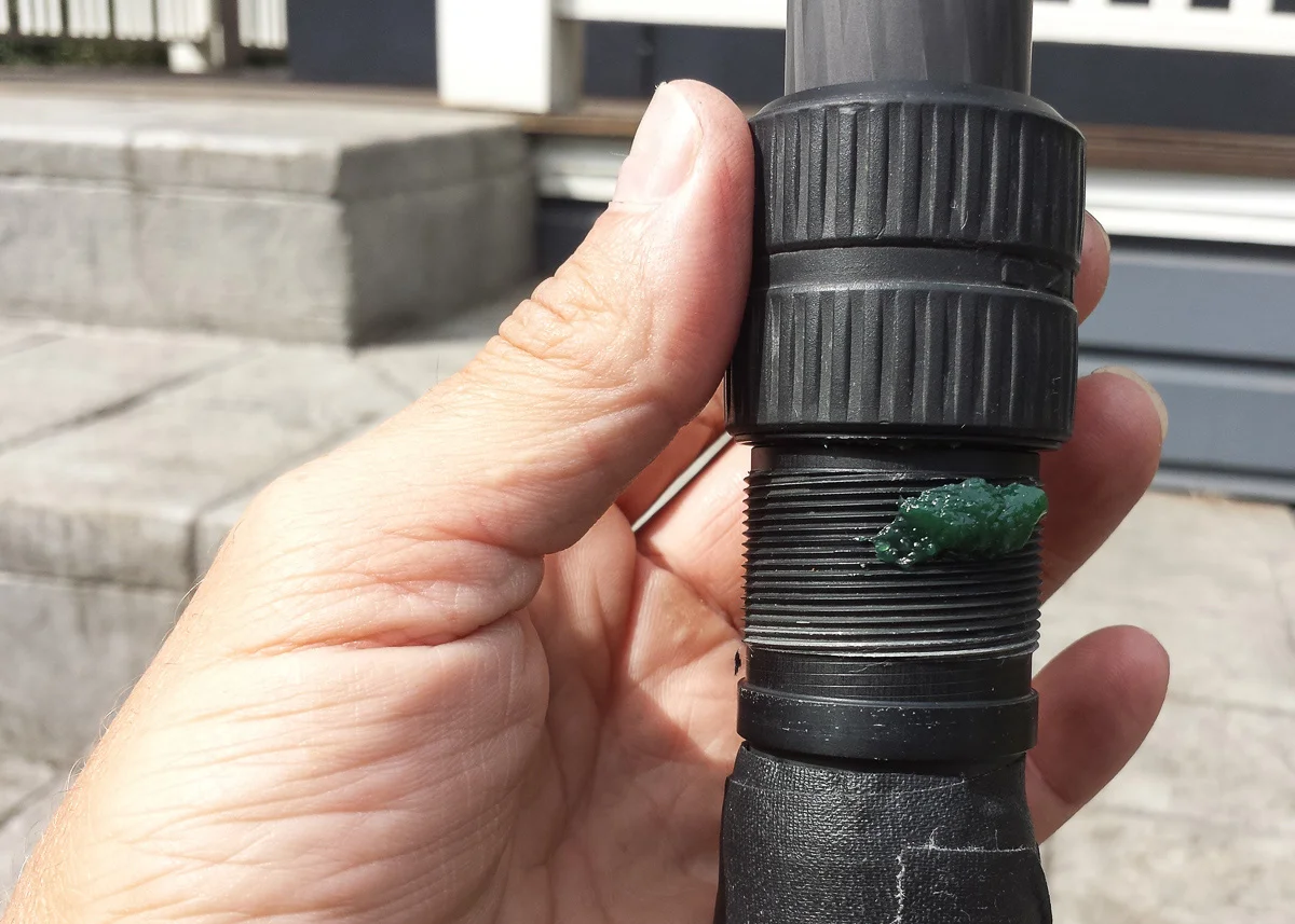 A bit of waterproof grease in the threads. Wipe off any excess after it's distributed to avoid attracting dirt.