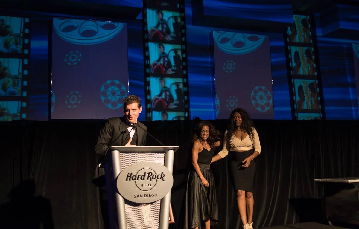 Andy Adkins accepts Best Director Award for An American Ascent at the San Diego Black Film Festival.