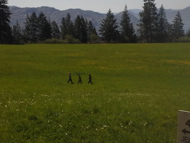 Joe shows the new recruits the hay field.
