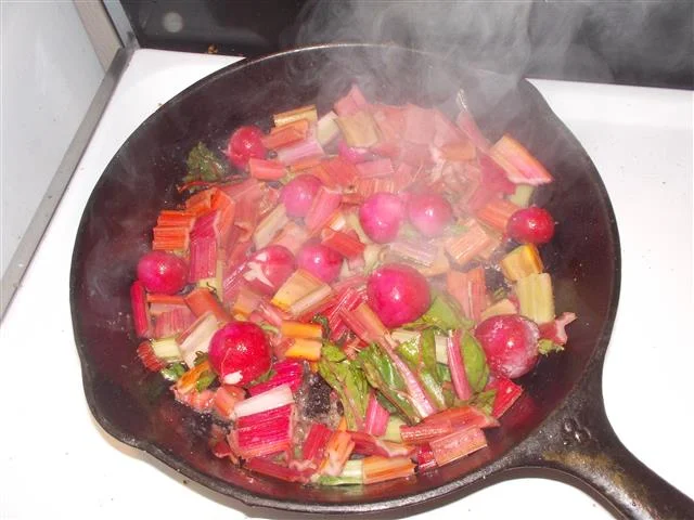 The other day I had some extra Chard and radishes. Together they make for some brilliant colours in the pan. Many don't realize that radishes sauteed or braised are super good. Use lots of butter if you dare.
