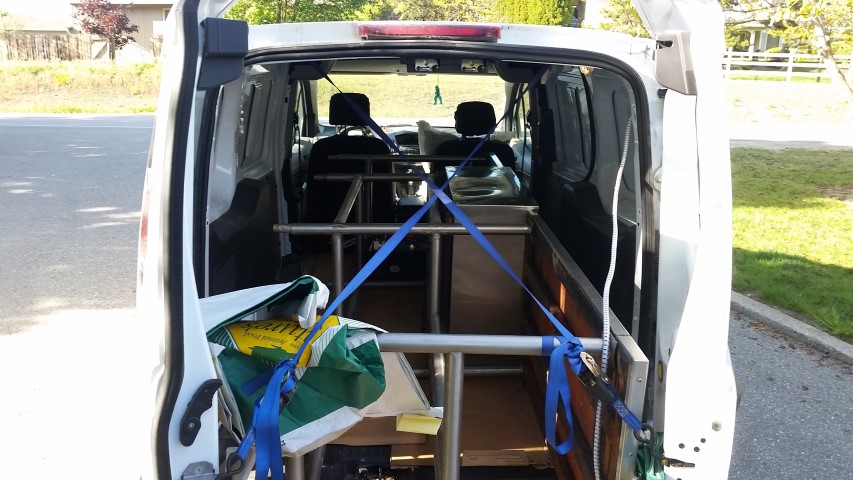  I saw a stainless steel sink for sale for peanuts on Castanet and raced down to Coldstream to grab it. It was too long for the van, so he drove all the way home with doors open. Whoops! 