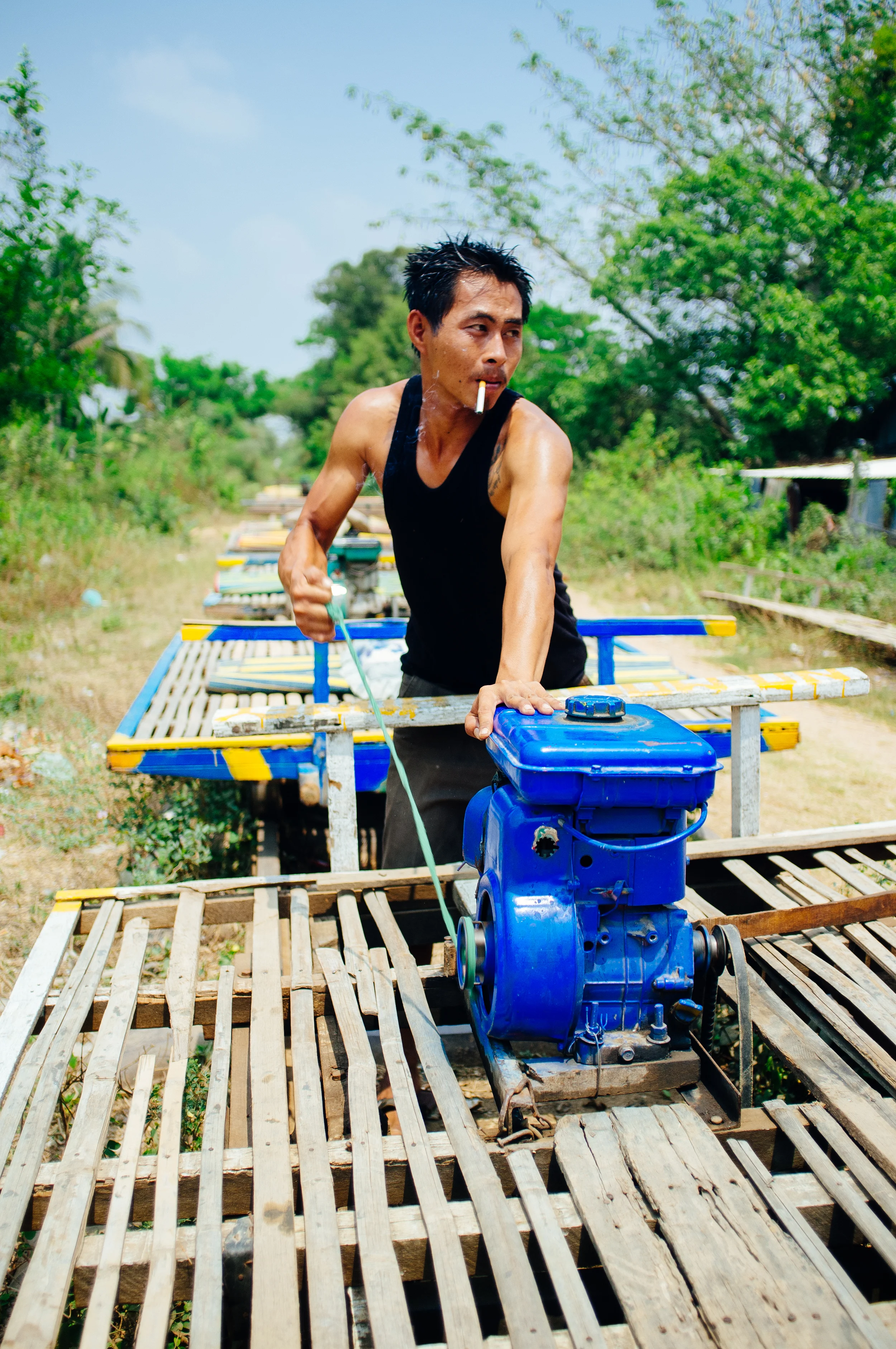 Cambodian Bamboo Rail Driver.jpg