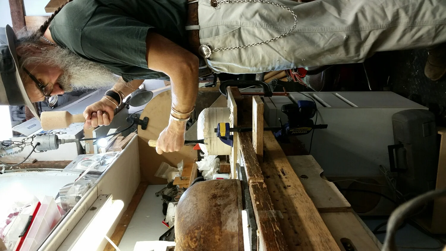 Hand carving the blocks we use to shape our hats . Still being done the way it should be done .
