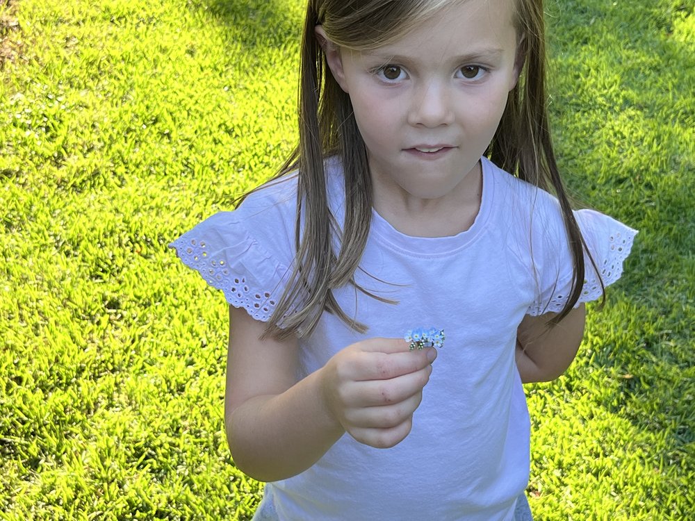 Avery with forget-me-nots.jpeg