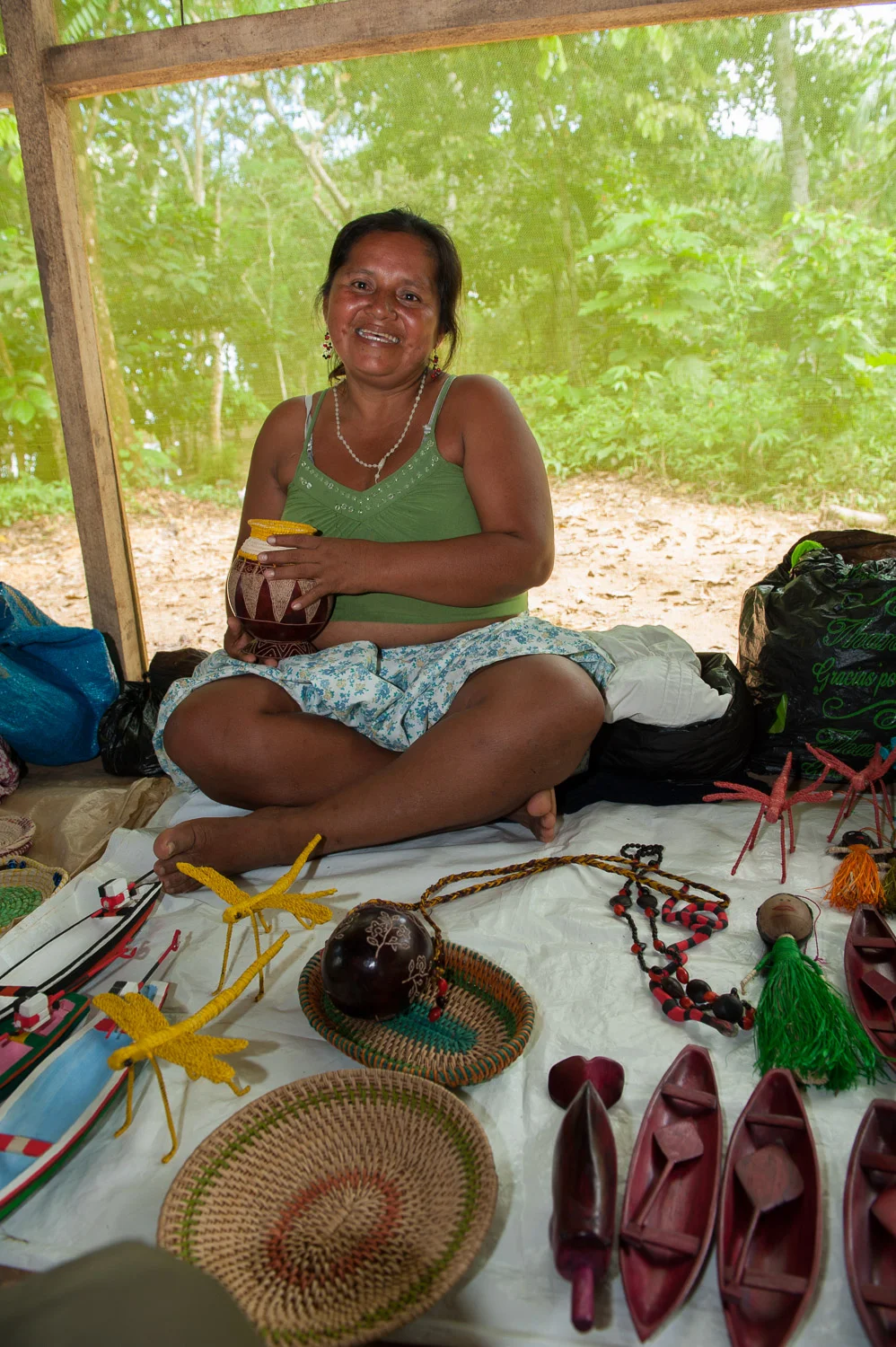 Local women display their traditional crafts for sale to eco-tour participants. Such income is critical to the families of Puerto Prado.