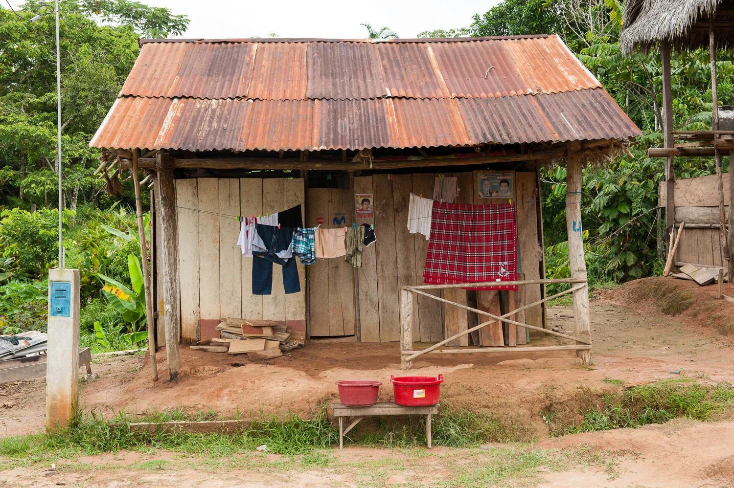 A typical home in the Amazonian village of Puerto Prado, Peru. More than 60% of the country's territory is covered by the Amazon rainforest, home to over 300,000 indigenous people who depend on it for their livelihoods. Although Peruvian law recognizes the rights of indigenous people to their land, it still foresees the possibility of granting concessions over these lands, if doing so is deemed in the national interest. 
