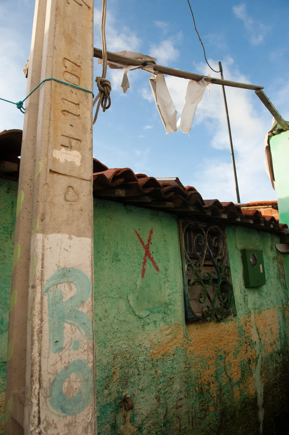 A modest favela (slum) home in the City of Fortaleza is tagged for demolition, the only notice that the City of Fortaleza gives residents of its plans to demolish the home.