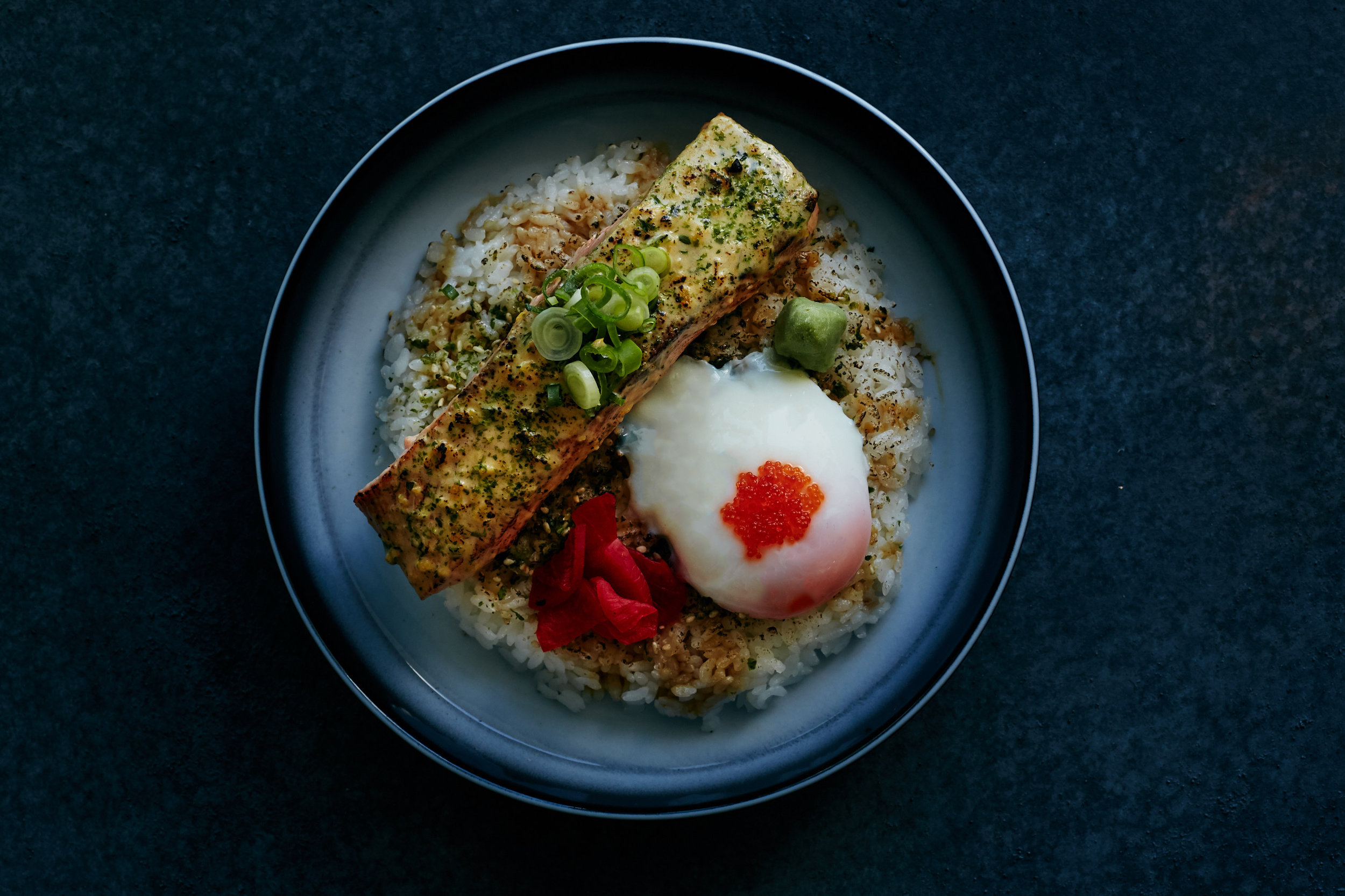 They torch the meat in front of you, before cracking an onsen egg on your rice bowl. 