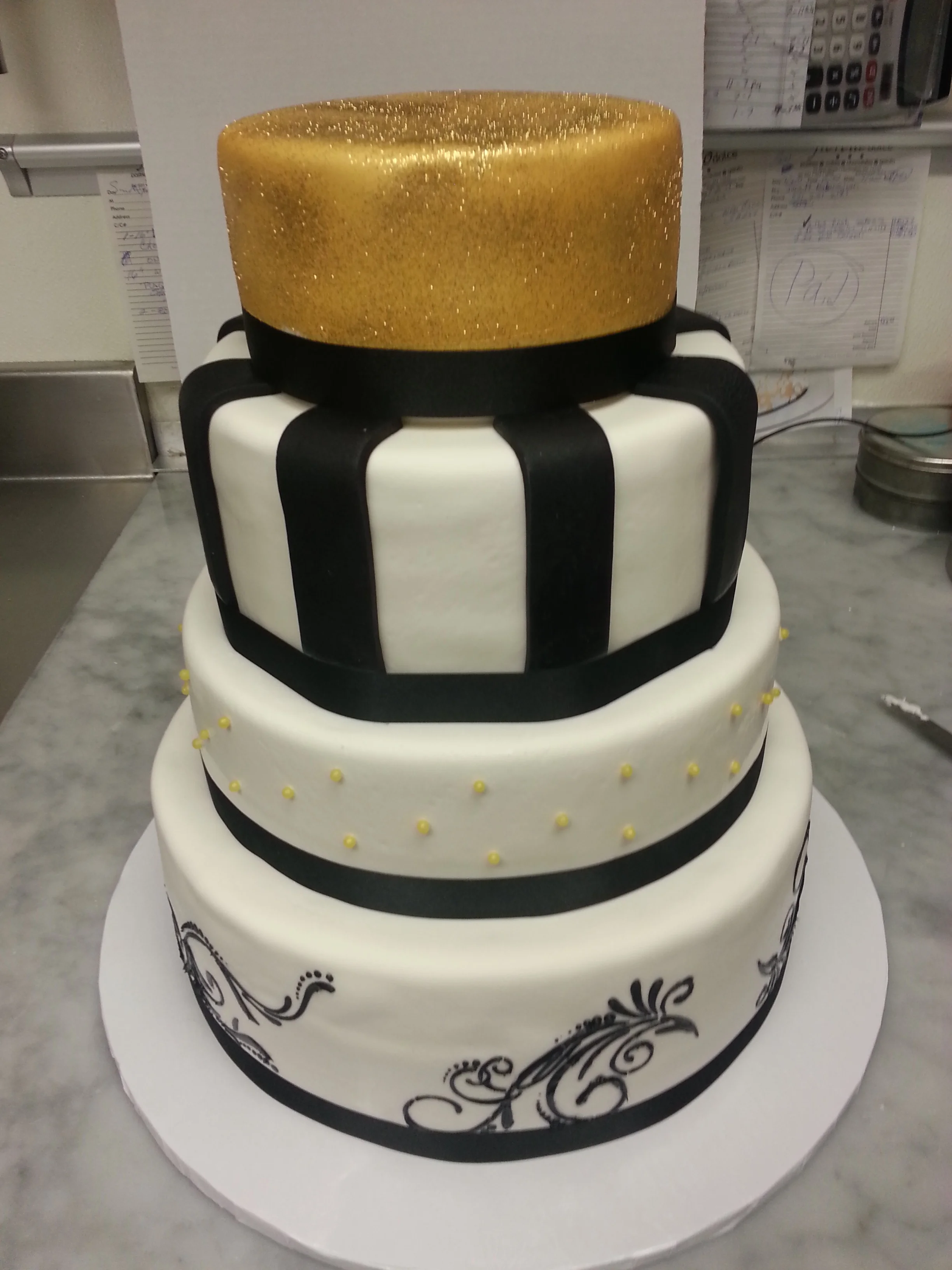 Wed Cake Gold Top Black Stripes.jpg