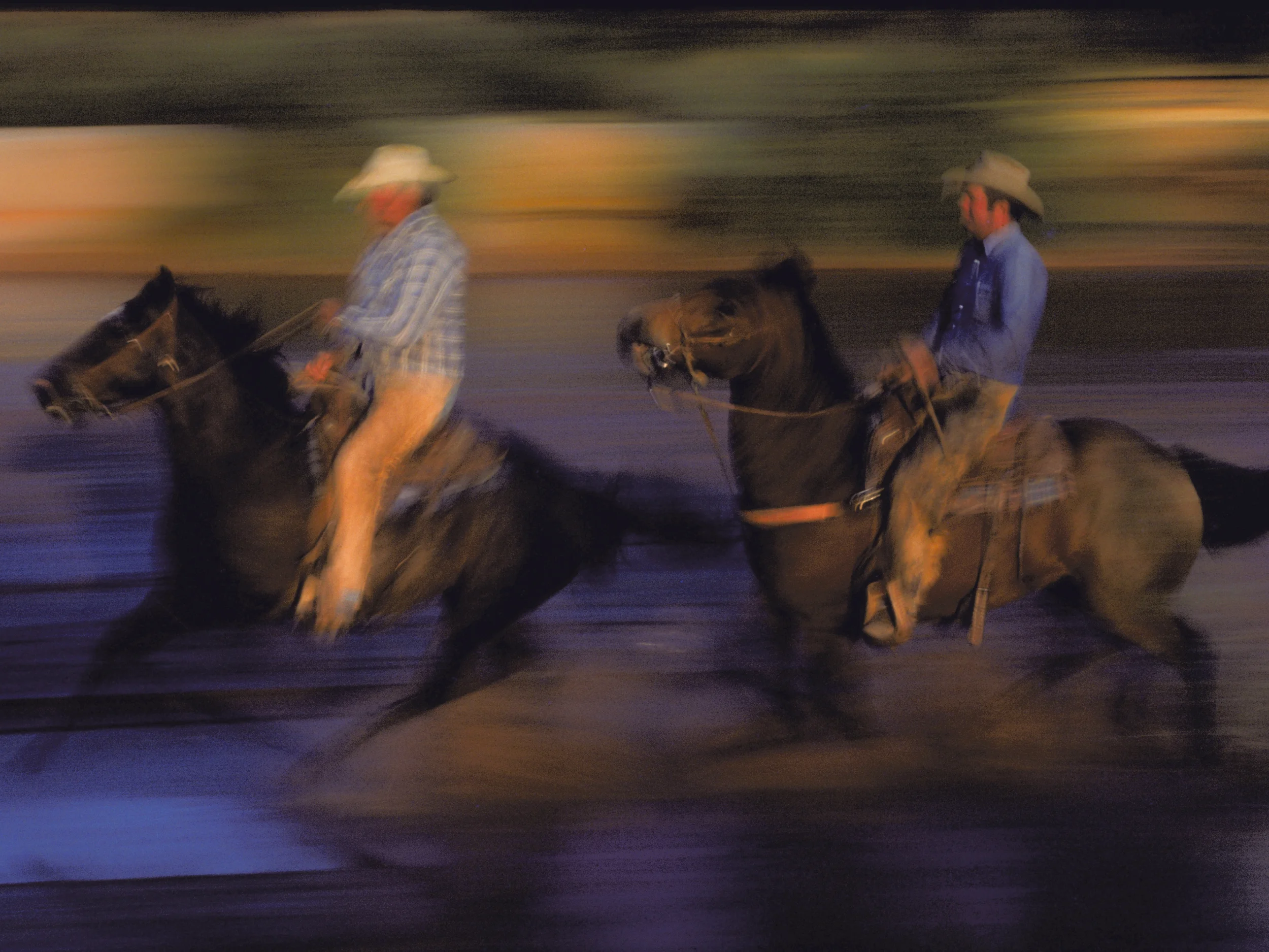 Cowboys on horseback ride through a creek water crossing. Copyright © Kipp Baker, All rights reserved