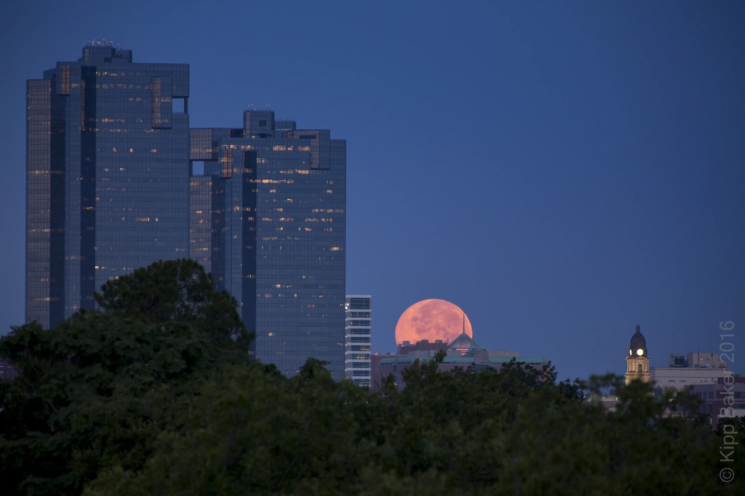 Supermoon setting over Fort Worth skyline at dawn Copyright © Kipp Baker, All rights reserved.