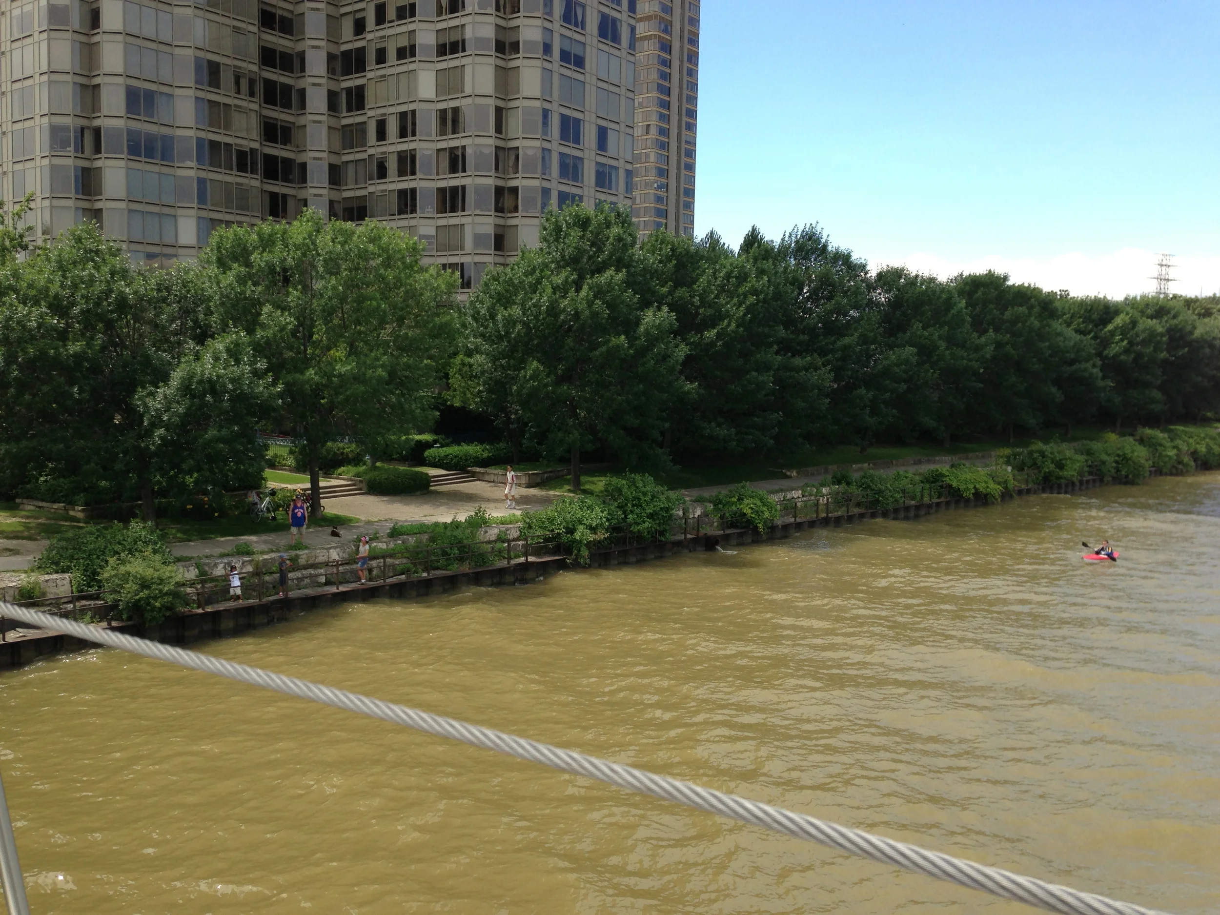 A kayaker paddles down the Humber River in contaminated water post-flood. Photo courtesy of Lake Ontario Waterkeeper. July 12, 2013.