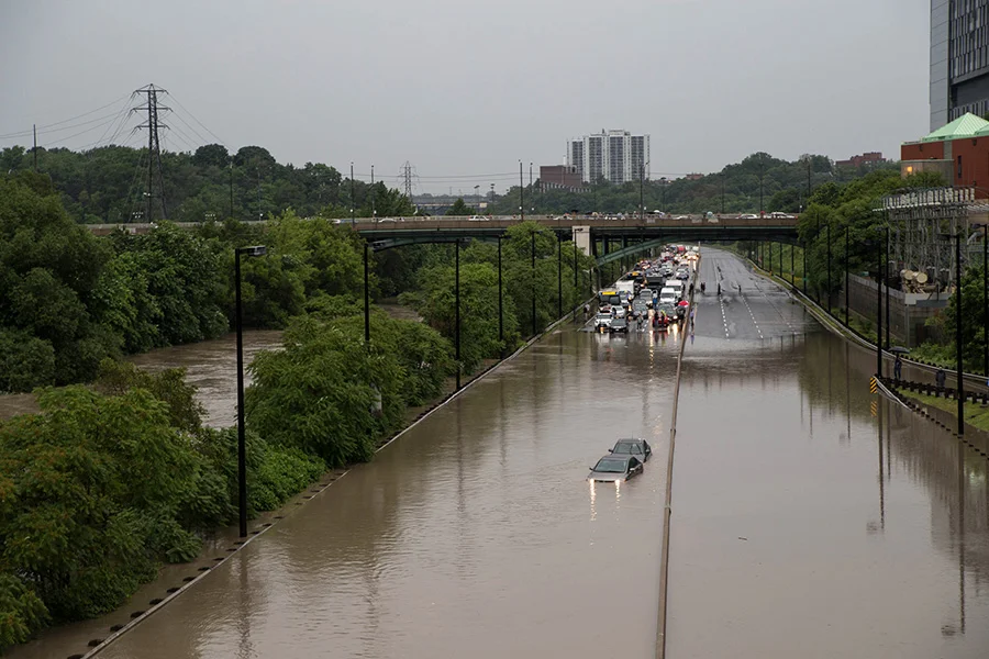 A scene from 2013's Toronto flood: an overwhelmed Don River merging with the DVP as traffic is at a standstill. (Photo by: Graeme & Sara Bunton & Peel )