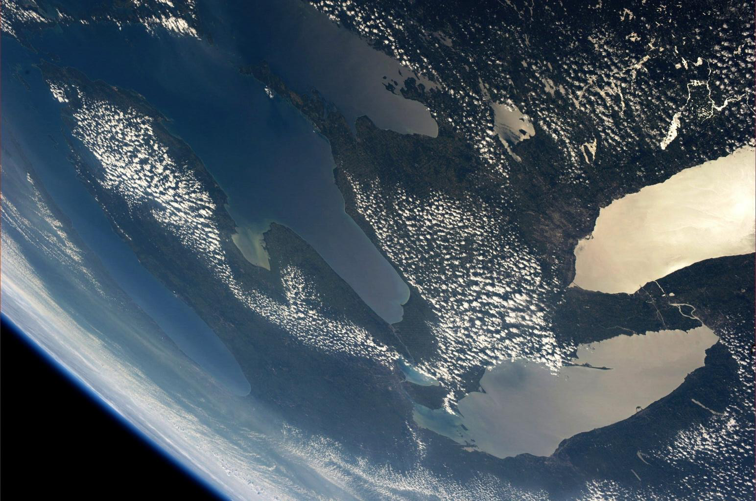 The Great Lakes, as viewed by American astronaut Karen L. Nyberg from the International Space Station, 2013. Lake Ontario is the body of water in the upper right. It connects to Lake Erie, below, via the Niagara River.