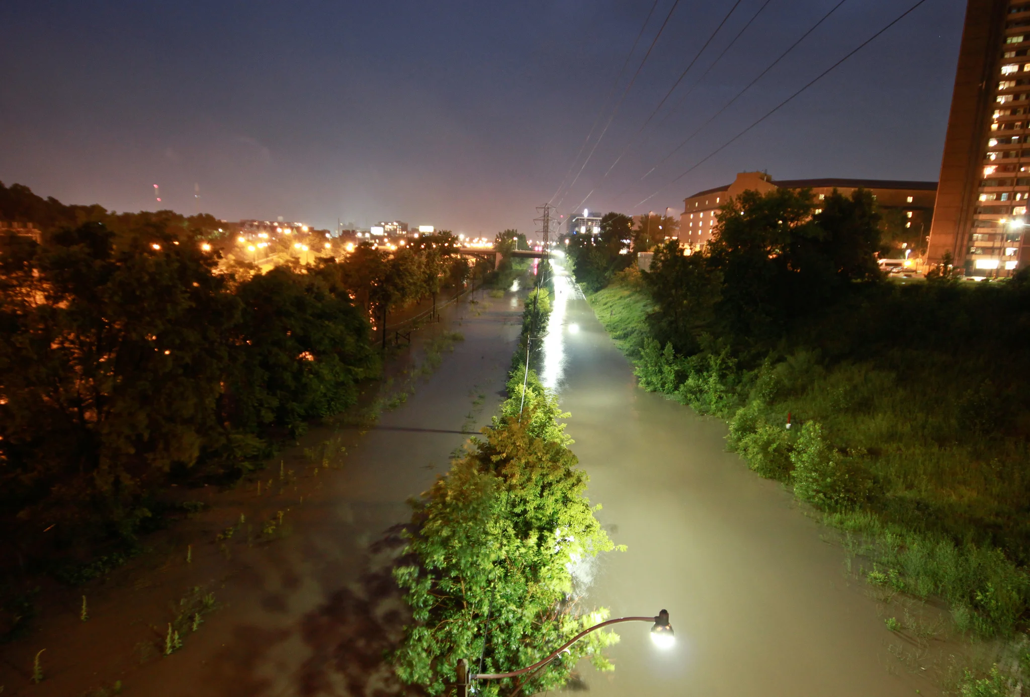 An overwhelmed Don River floods Bayview Avenue and the southern end of the Don Valley Parkway caused by the summer storm of July 2013. (Photo by Roozbeh Rokni .)
