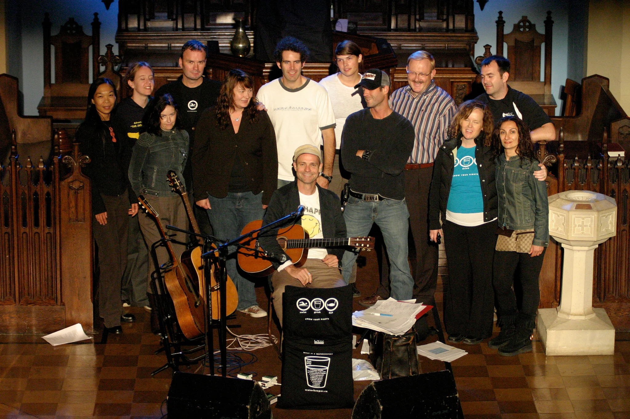 Gord Downie (centre) and Mark Mattson (third from the left, back row) with the Heart of a Lake crew after the final show of Waterkeeper's tour in 2006. Photo by Dylan Neild.