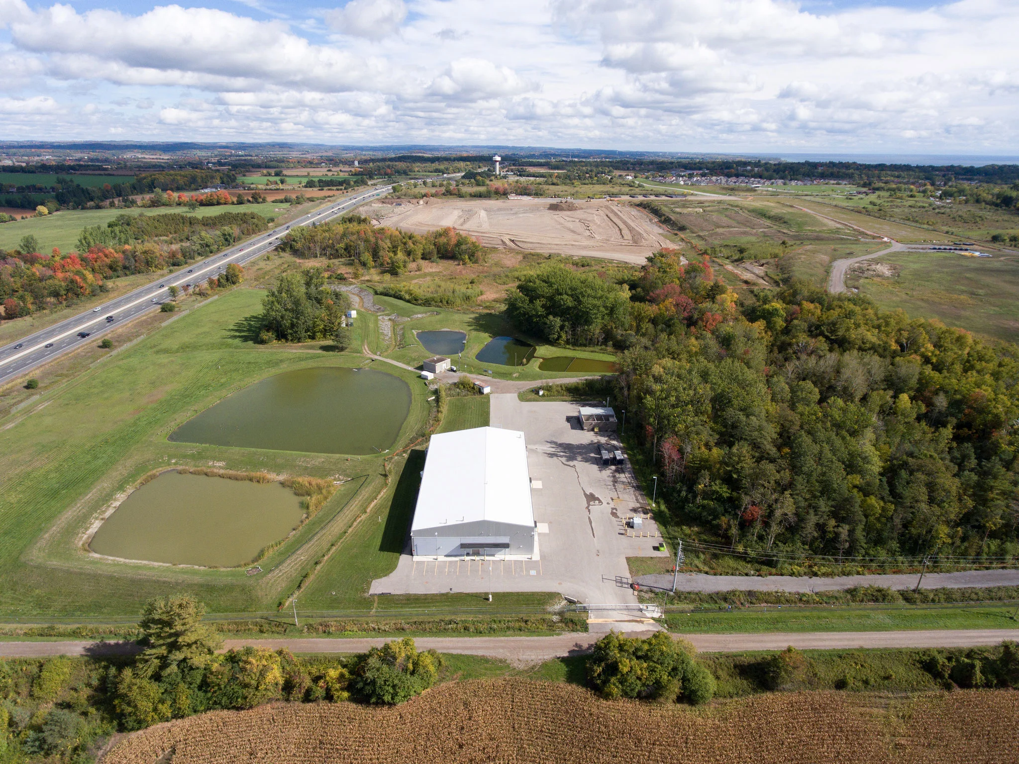 The open space seen in the background, beside the 401, is the storage site for Port Hope's low-level radioactive waste. (Photo by Dylan Neild)