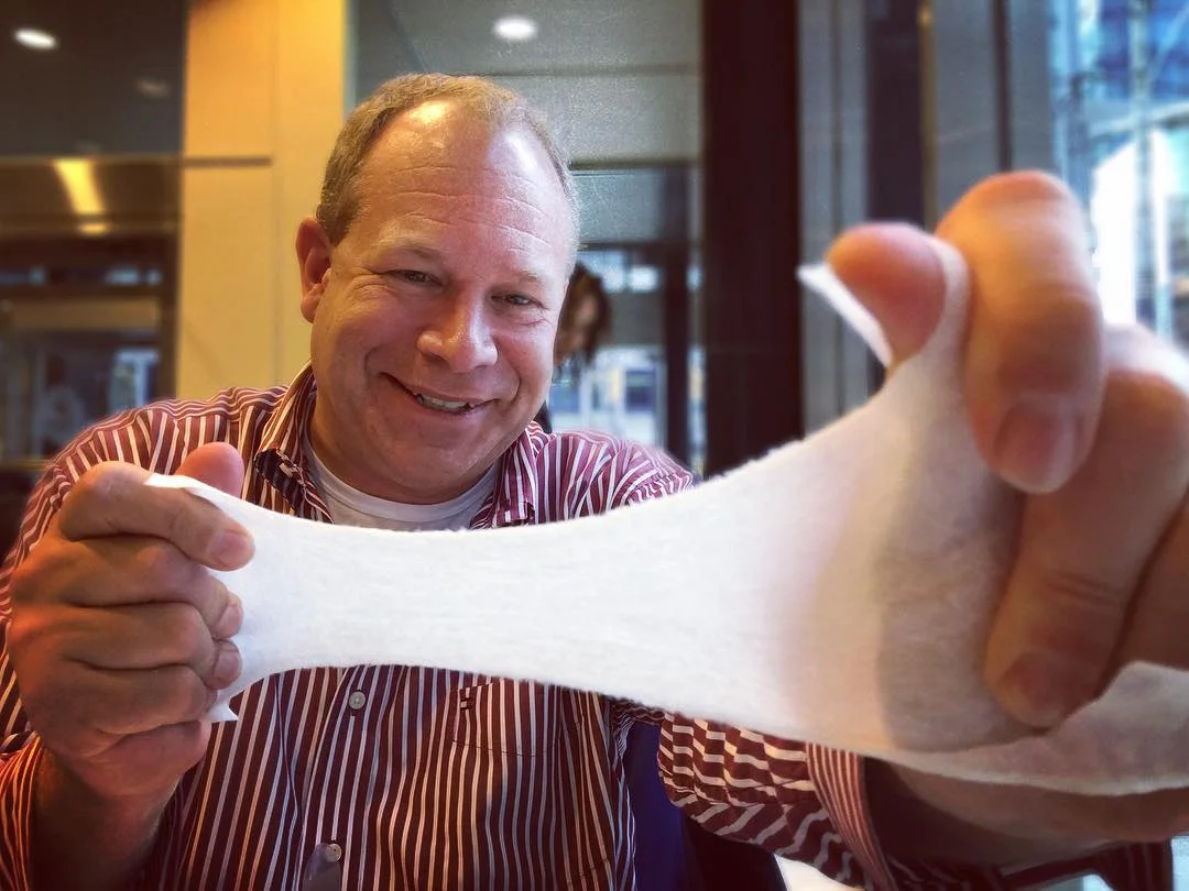 Barry testing the durability of a baby wipe. Photo by Ruby Pajares. 