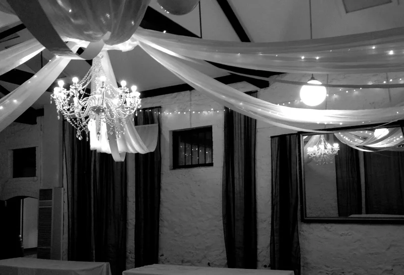 White ceiling canopy with large chandelier.