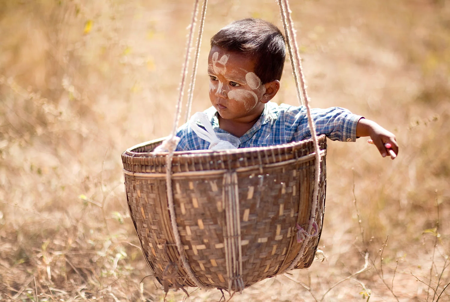 Basket boy, Bagan, Myanmar