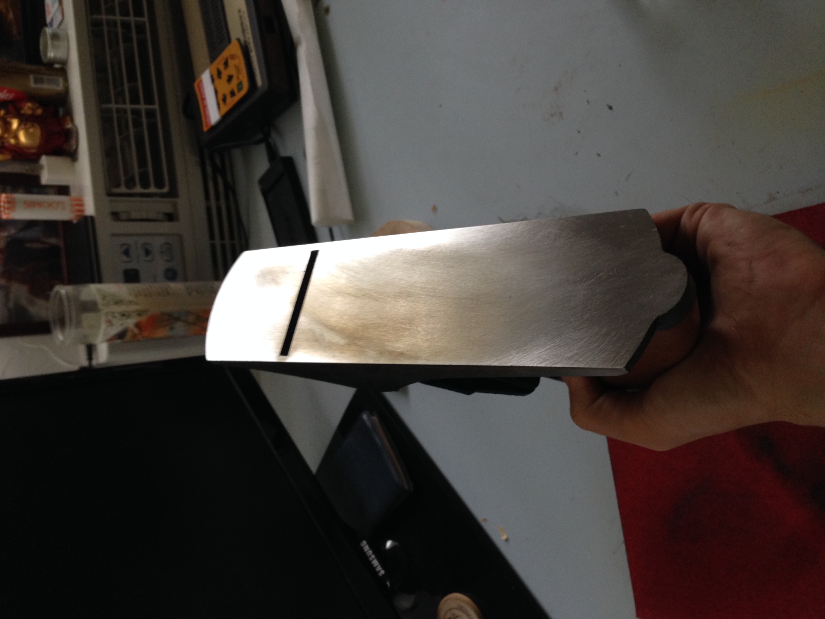 You can see how uneven the sole was when I started. The darker yellowish spot towards the middle is a high point cause by bad machining at the factory. I think I lapped it for another two hours and still didn't get it fully flat.