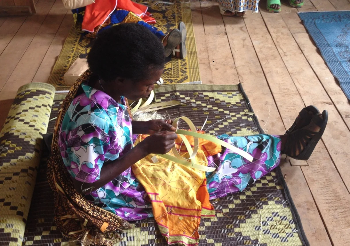  A weaver demonstrates the initial phase of creating a basket