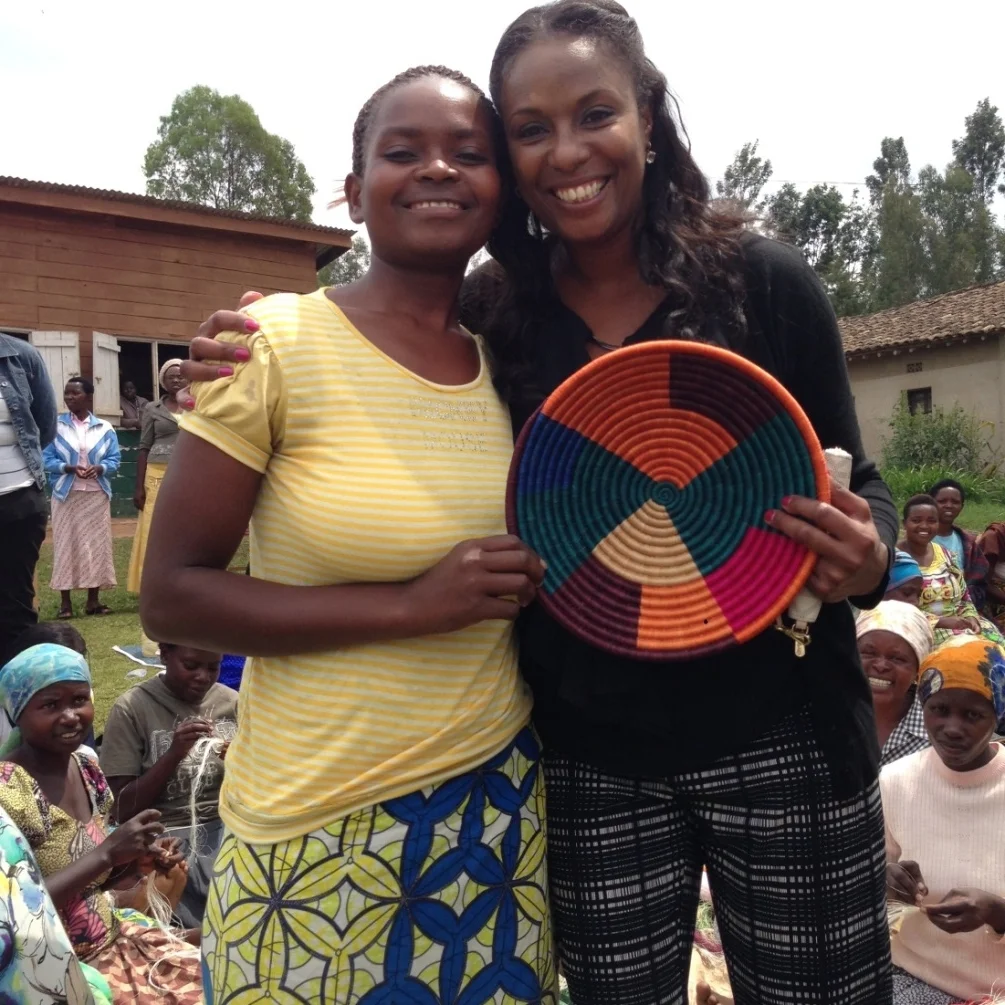 Director of Global Programs, Natika Washington visits with a weaver at the Kayonza cooperative