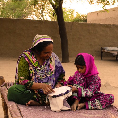Artisan working by hand on a patterned textile