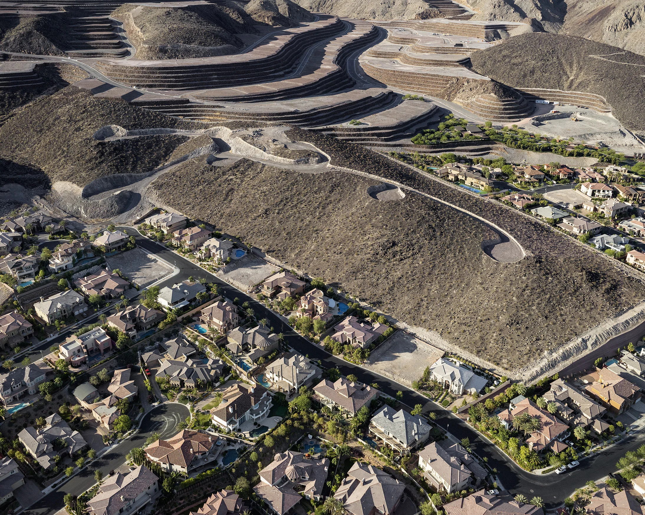 20. “Roma Hills” homes and foreclosed “Obsidian Mountain” development, “Ascaya” lots beyond, looking south, Henderson, Nevada; 2012