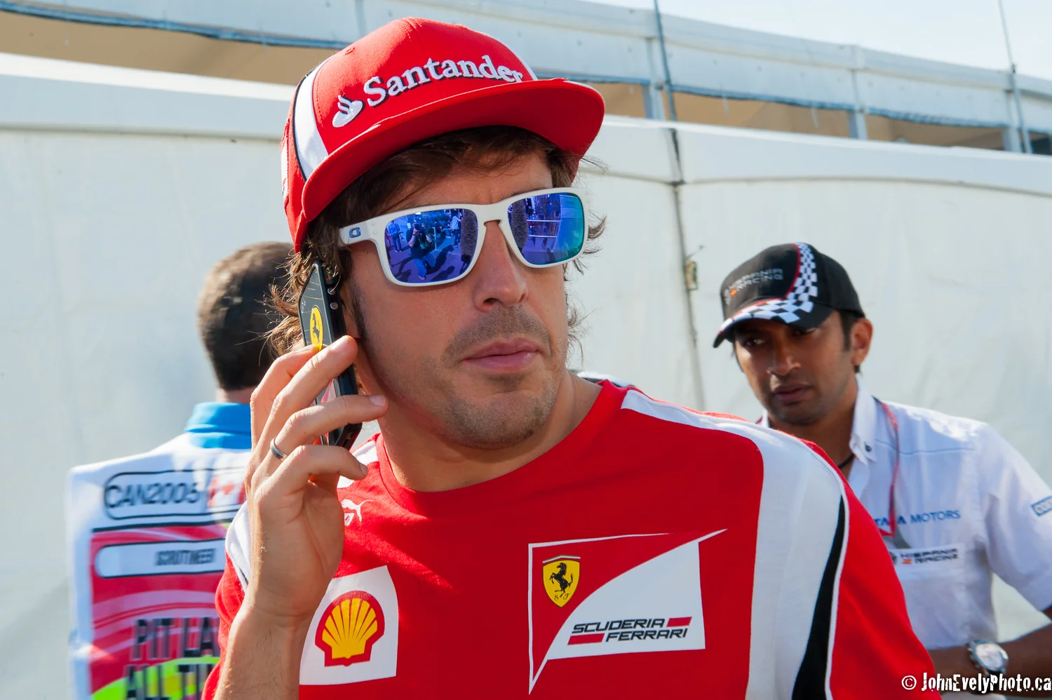Fernando Alonso in the Paddock area trying to make reservations at Schwartz's.