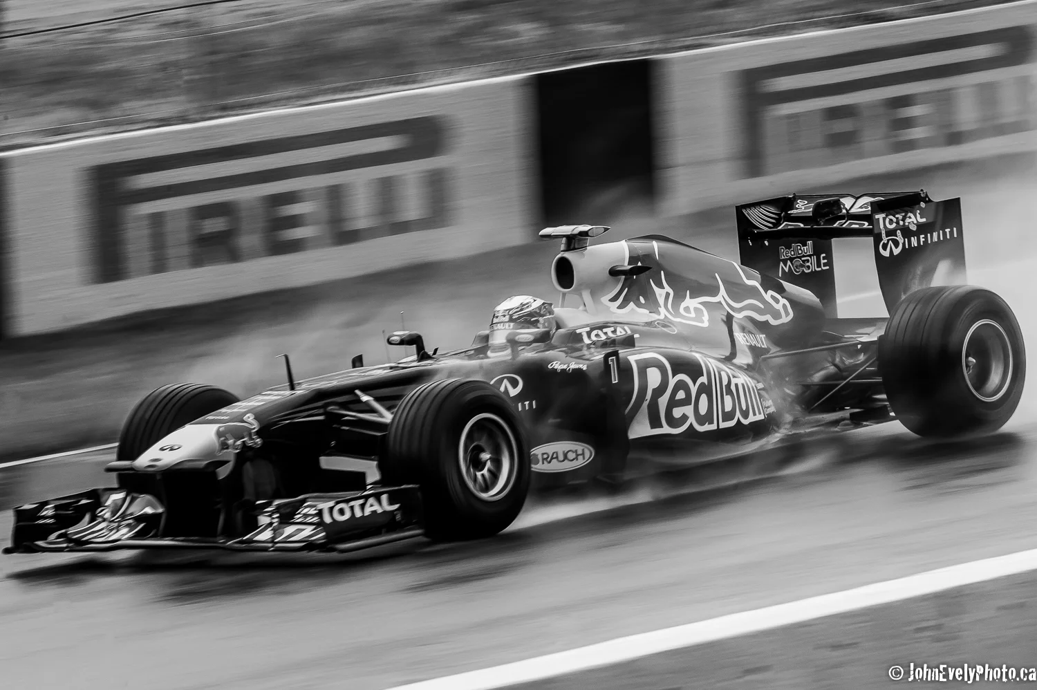 Seb Vettel driving in the rain at 325 kmph on the start/finish straight-away.