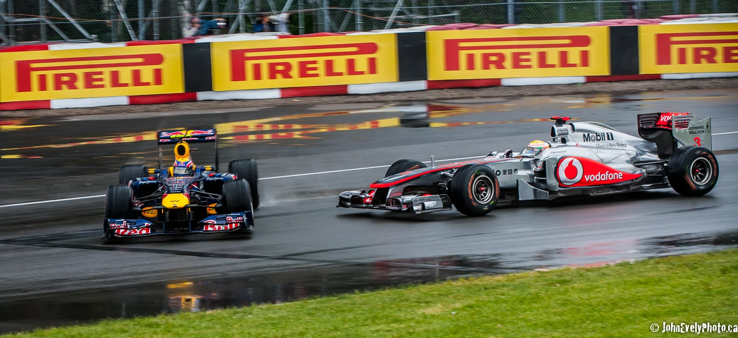 Red Bull's Mark Webber gets punted into turn one by his mate Lewis Hamilton in his McLaren.