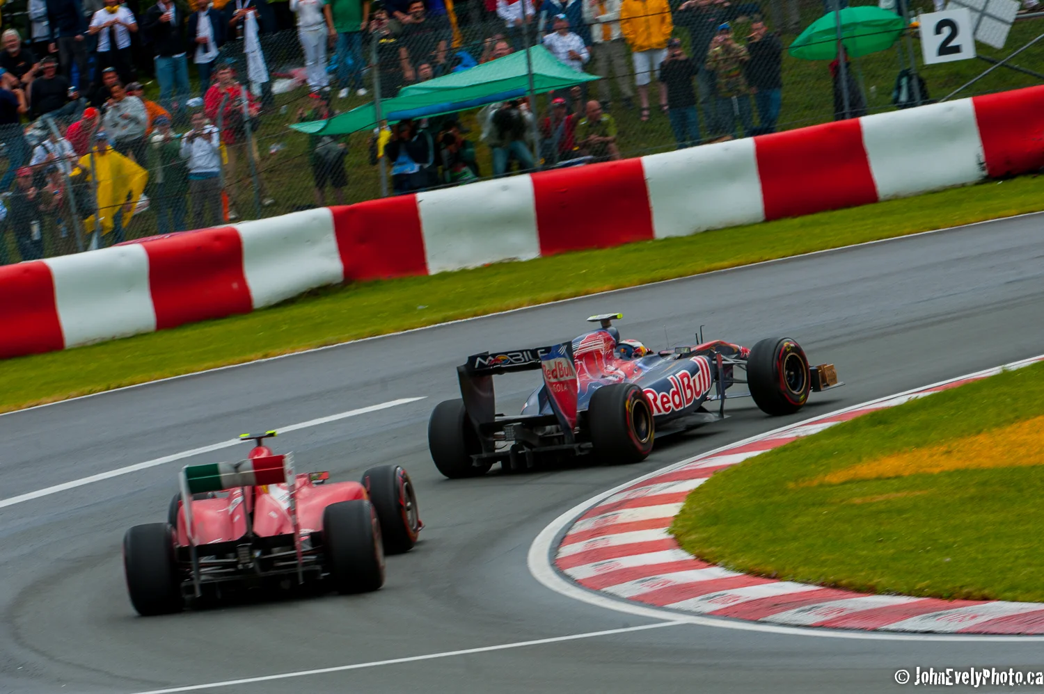 Red Ferrari chasing a Toro Rosso. 