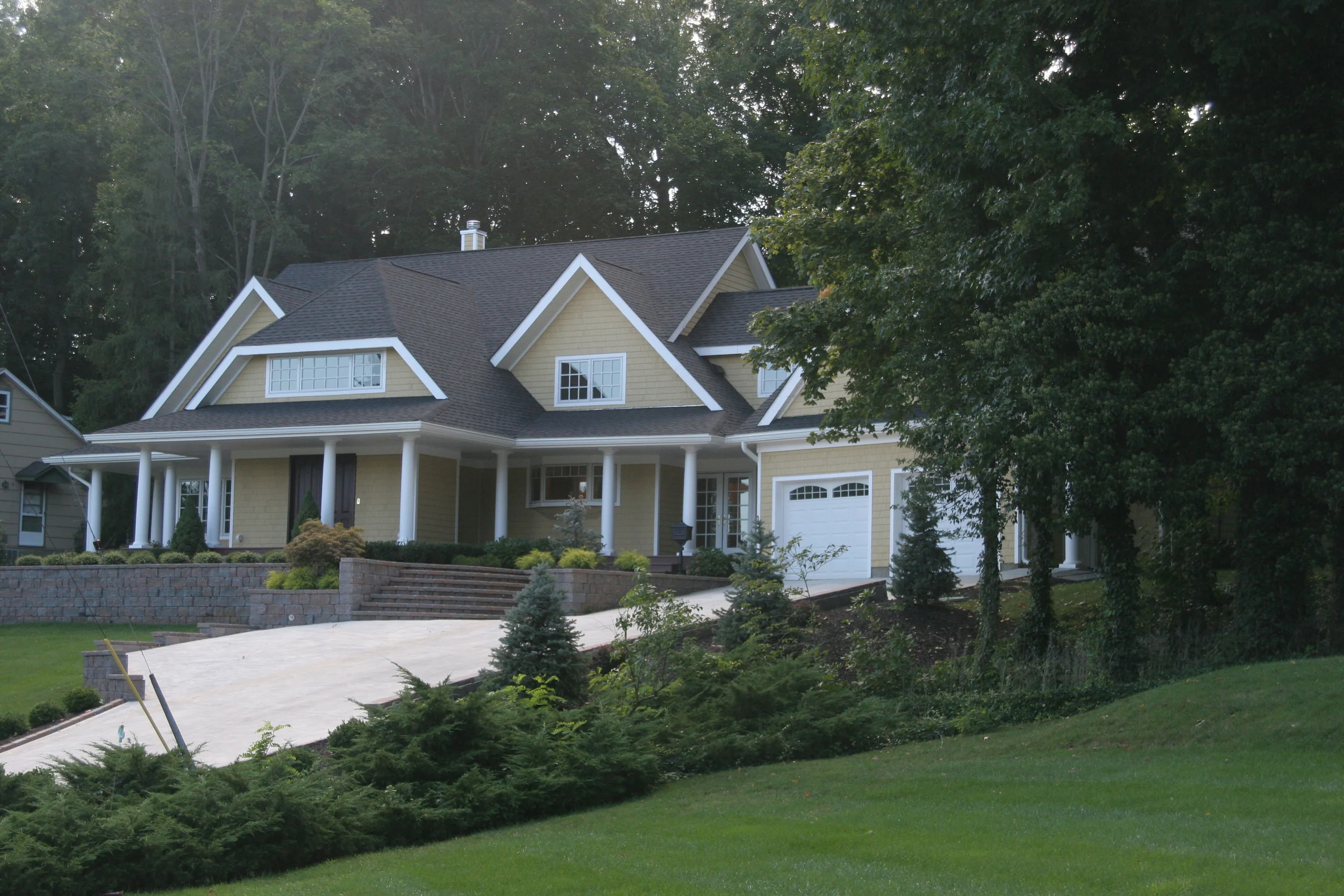 Nottingham Way | This home is the unification of the components of a pre-existing pre-fabricated house, with new traditionally constructed components sympathetic to the original system. The site’s severe grade allows for ample opportunities to create outdoor rooms, which compliments the home’s floor plan.