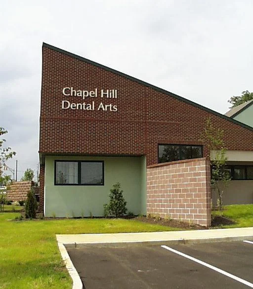   Chapel Hill Dental Arts | &nbsp;Is a full service dental facility with patient areas and areas devoted to the manufacturing of porcelain prosthetics.&nbsp; The building sits on an extremely busy state highway.&nbsp; The design successfully shields 