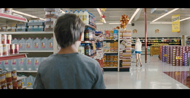 PHOTO CREDIT: Above screenshot is of Ellis as he follows Juniper (Witherspoon) around inside the Piggly Wiggly.