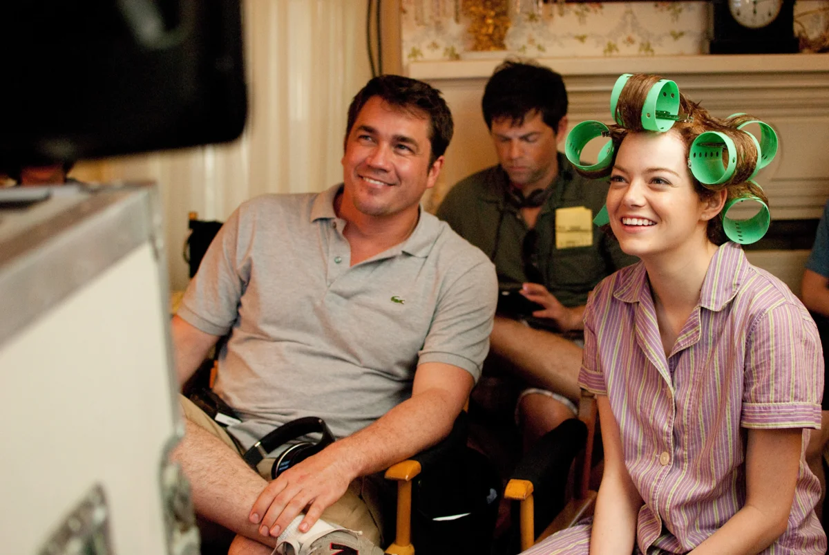 Photo of Director Tate Taylor (left), Brunson Green (center), and Emma Stone (right) on set is from here .