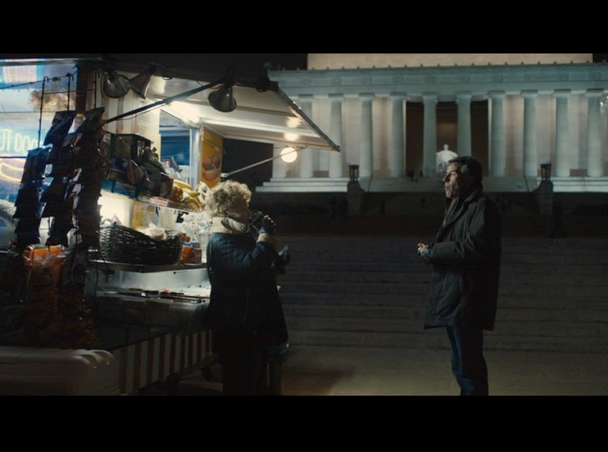 Screenshot: Martin and Philomena in a deep conversation in front of the Lincoln Memorial. The hot dog stand and the Monument in the background provided enough crucial and ambient lighting for the entire frame.