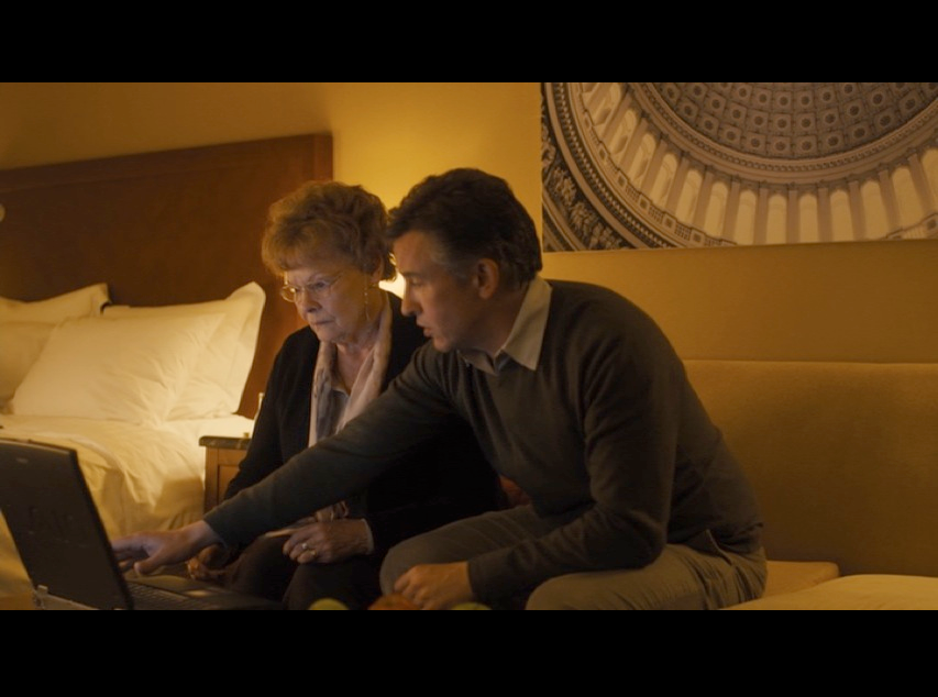 Screenshot: Philomena and Martin in the D.C. hotel room. This was actually filmed at the London Marriott Hotel Regents Park. Check out the artwork of the U.S. Capitol on the wall behind them. Nice touch.