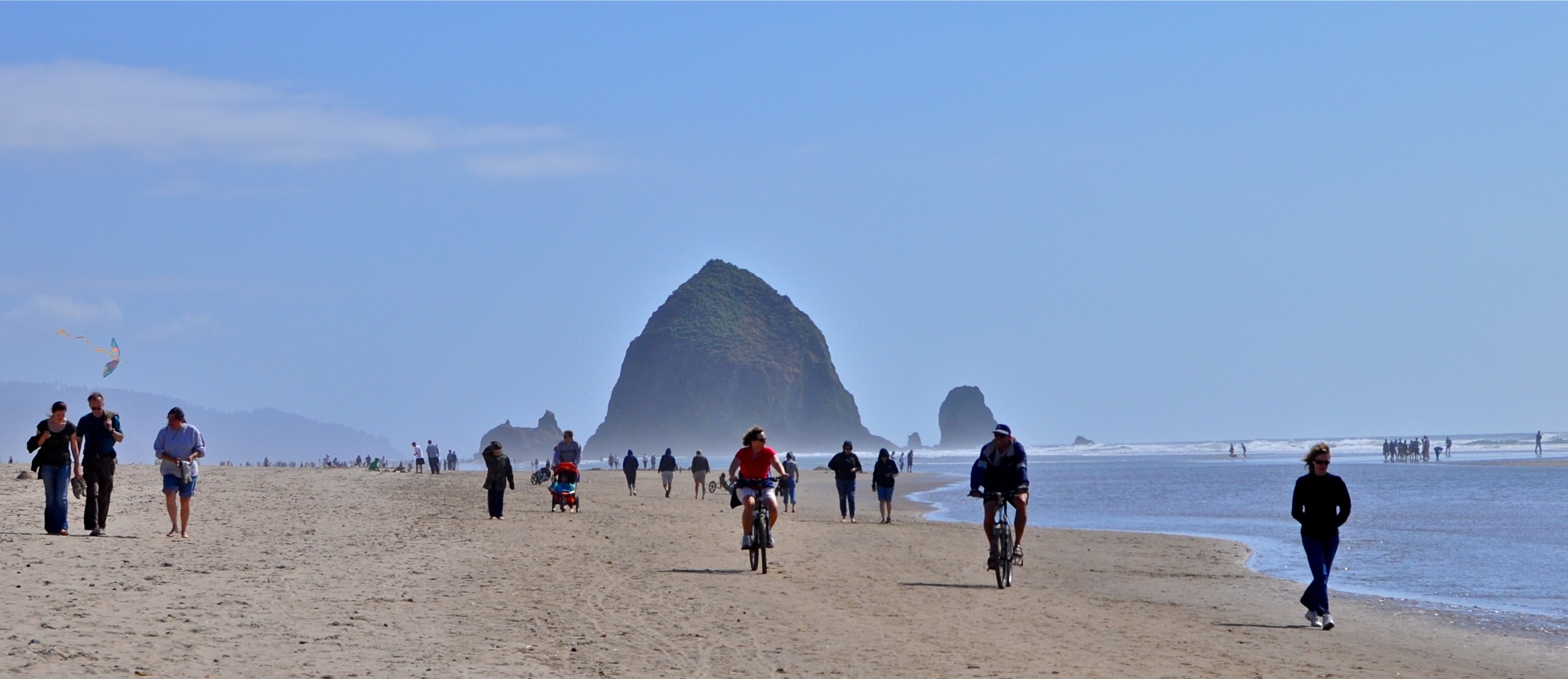 The beautiful and super-wide beach of Cannon Beach by Haystack Rock - image via Google .