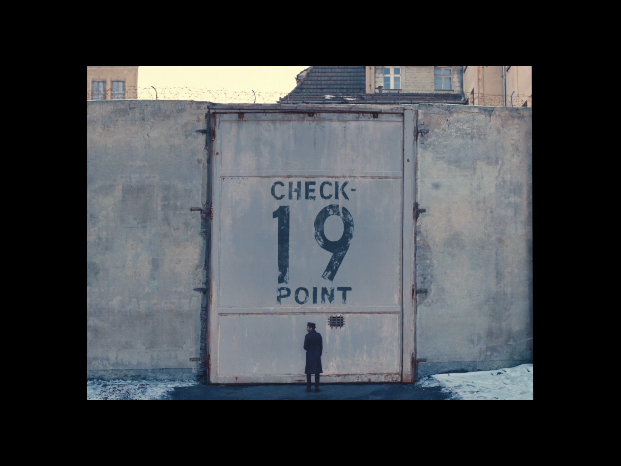 Screenshot from the movie of Zero standing outside Check Point 19.