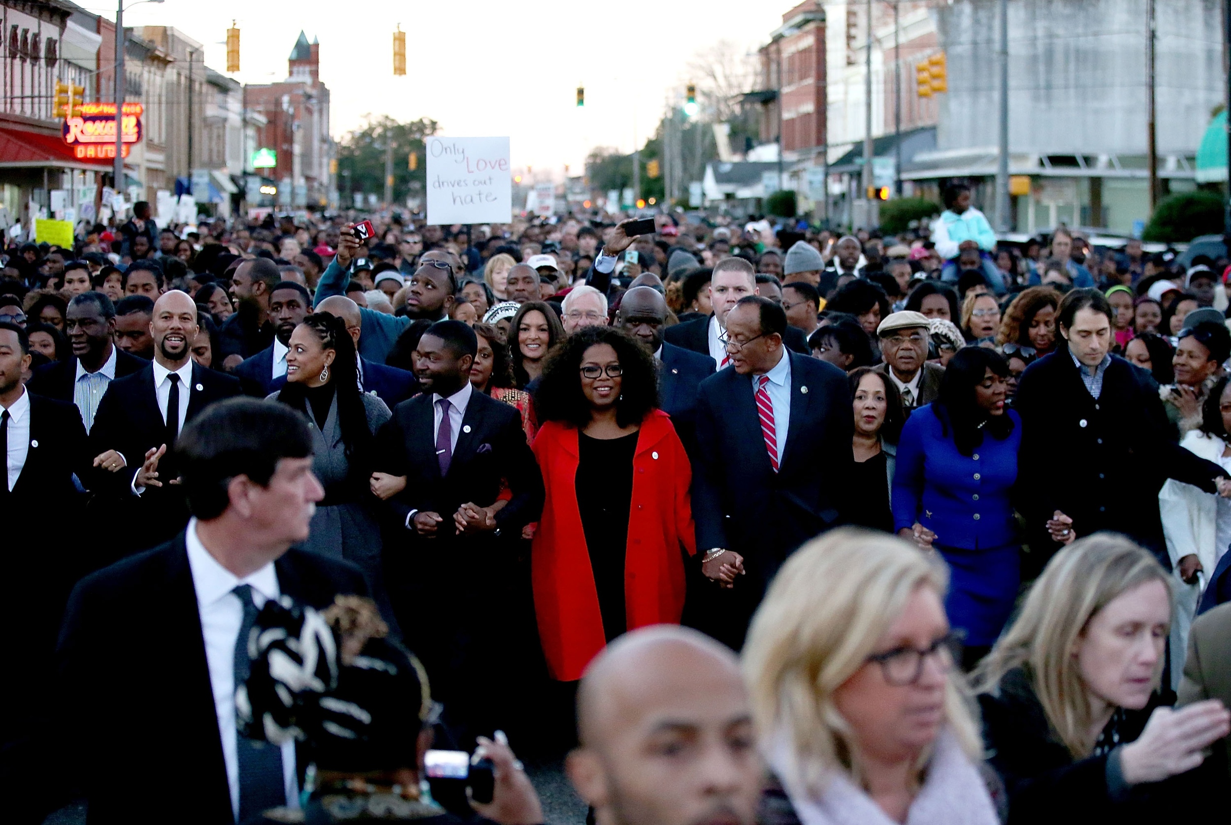 Oprah Winfrey and the cast of Selma walk down Broad Street towards the Edmund Pettus Bridge accompanied by thousands of participants in honor of Rev. Martin Luther King Jr. Day on January 18, 2015 in Selma, Alabama. (Photo by Sean Gardner/Getty Images )
