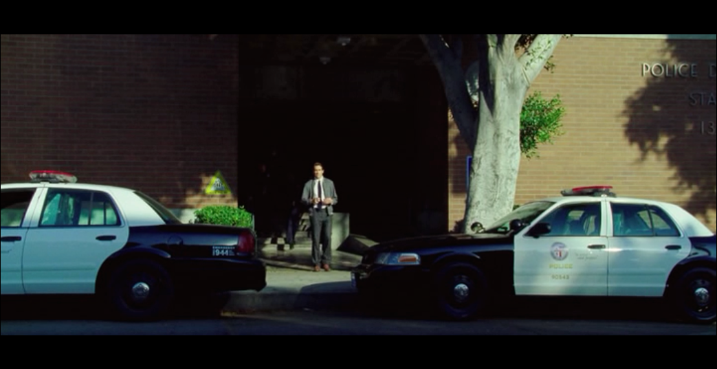 Screenshot from Nightcrawler of Lou&nbsp;Bloom as he exits the police station - filmed at the real-life LAPD Hollywood Station.