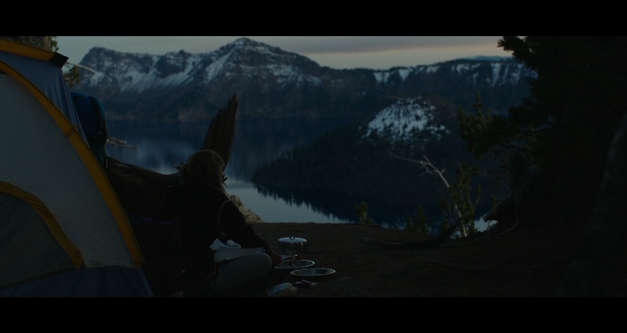 Screenshot of a scene filmed at Crater Lake as Cheryl (Reese Witherspoon) camps for the night at the deep blue lake.