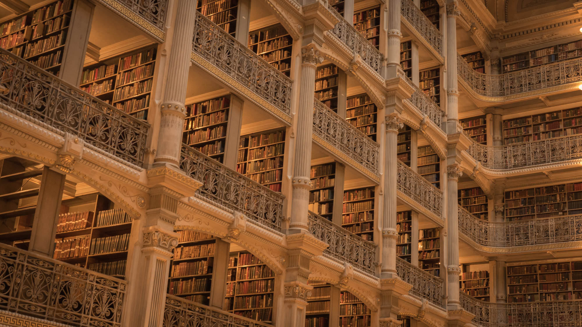 The George Peabody Library is world-famous for its beautiful five tiers of ornamental cast-iron balconies rising 61 feet above the floor (ironwork fabricated by the Bartlett-Robbins & Company). 