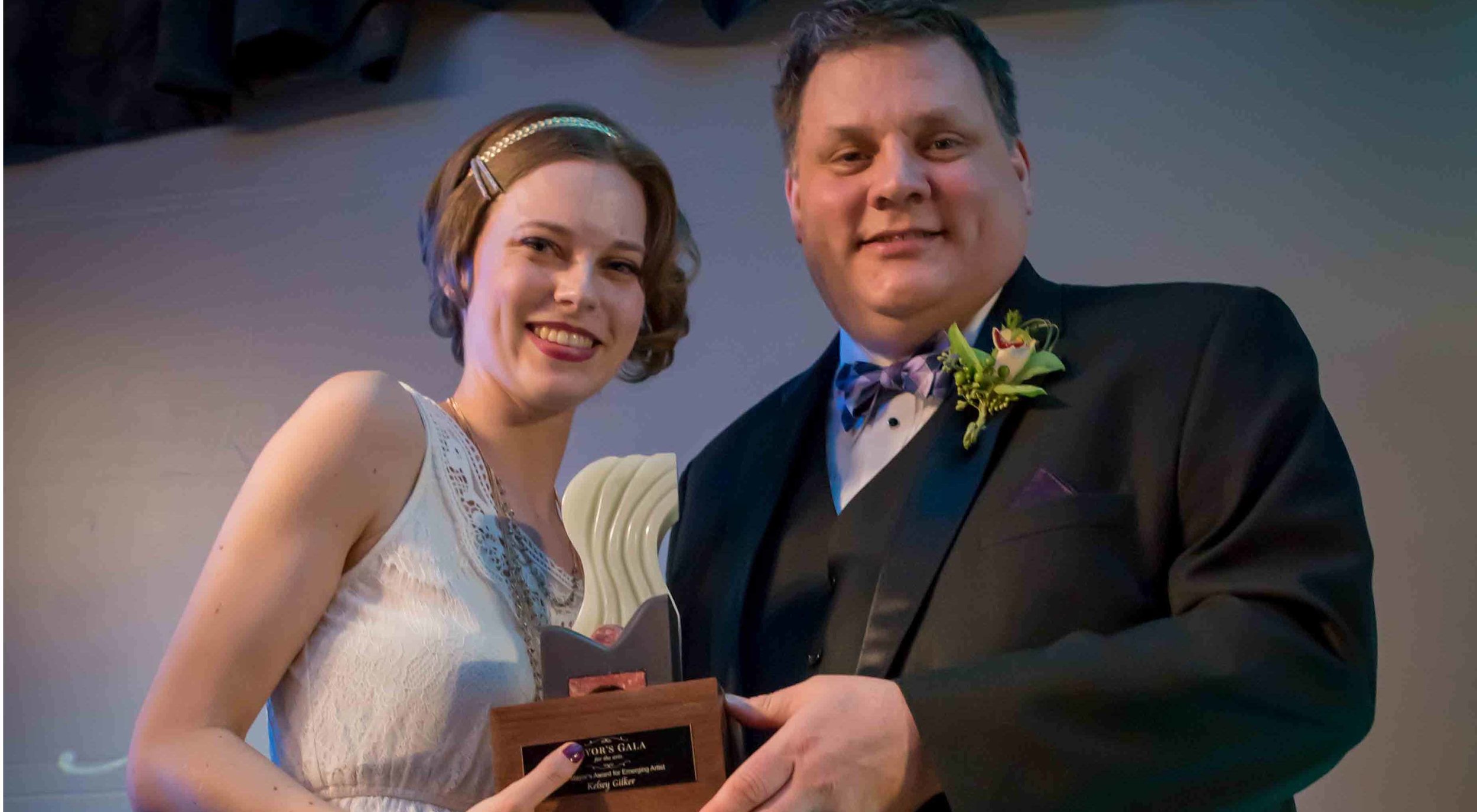 2016 EMERGING ARTIST WINNER KELSEY GILKER, LEFT, RECEIVES HER AWARD FROM MAYOR PETER MILOBAR. | IMAGE: KAMLOOPS THIS WEEK