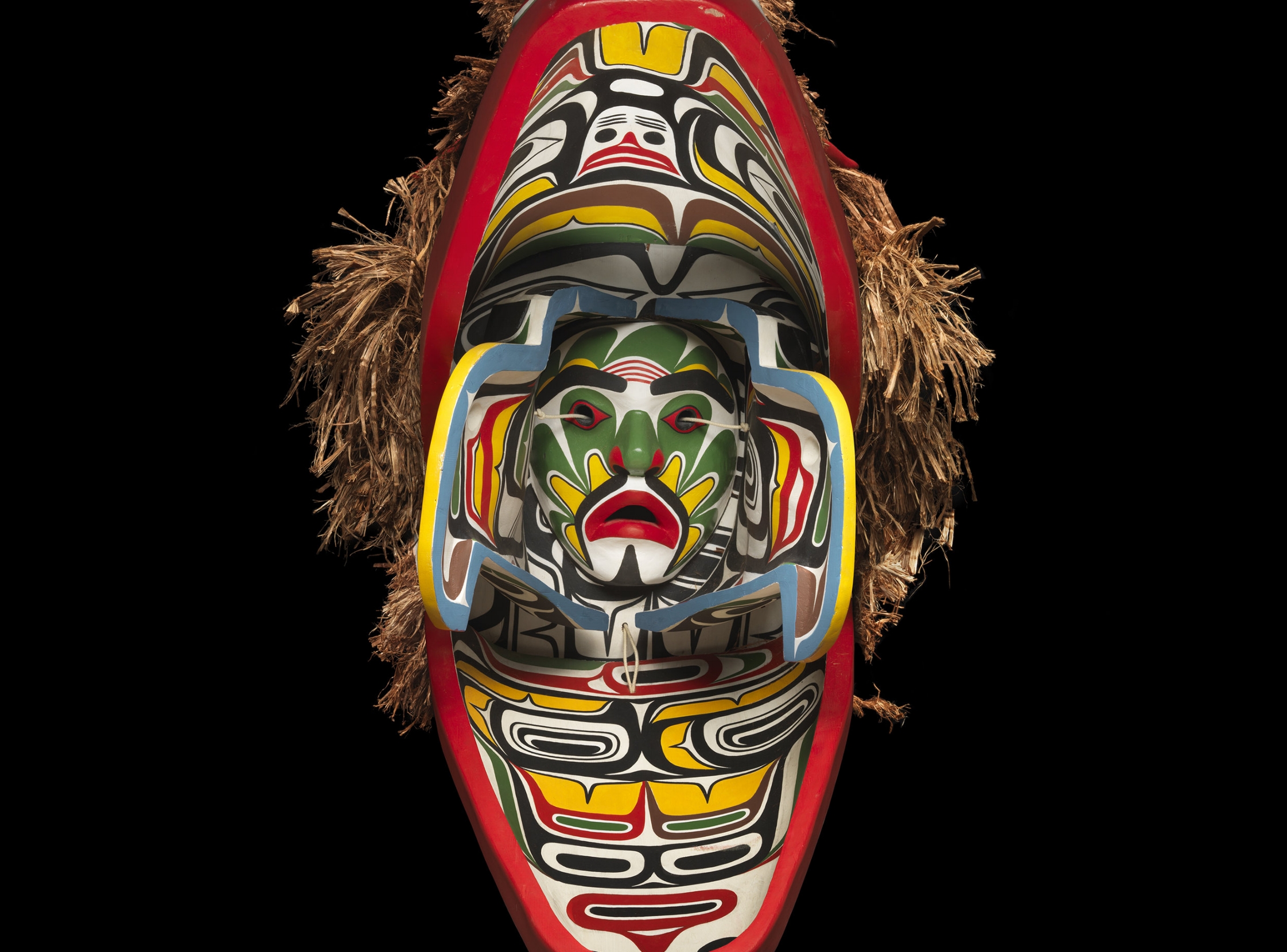 Beau Dick’s Sculpin Mask opens to reveal a human face. | Image: