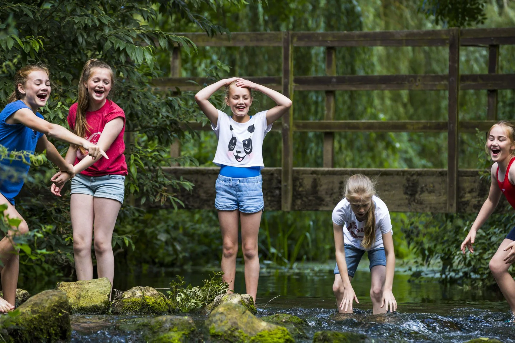 South east brand and reportage photographer, lifestyle photography, girls playing in stream, 