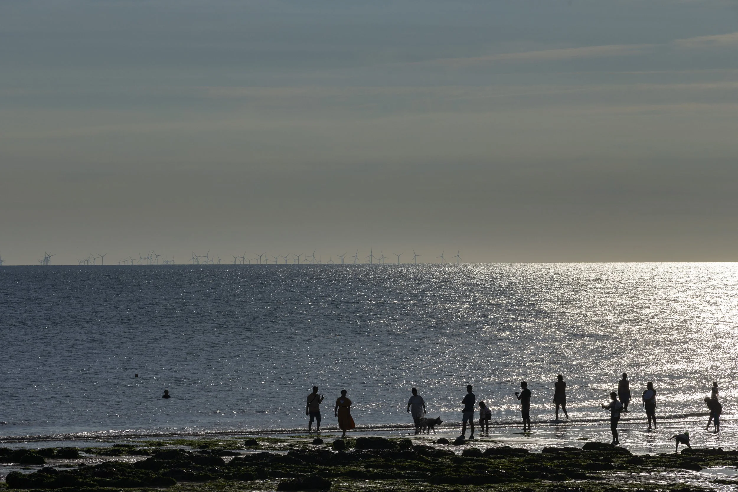 London and South East, brand and reportage photographer, Chris Lacey. Birling Gap, people on beach