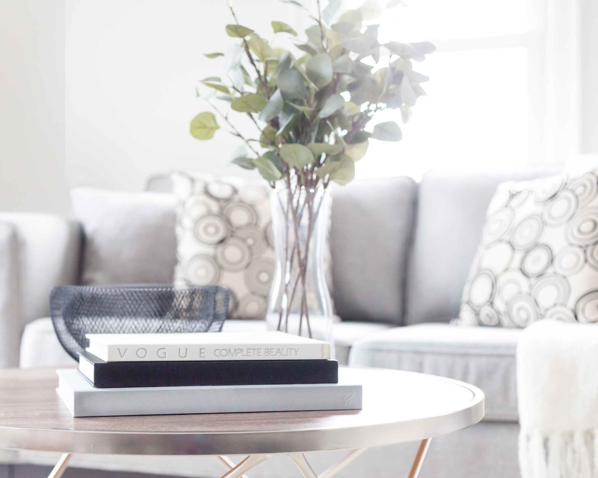 Home Interior Staging in Barrie provided by New Leaf Decor. Coffee table books are great staging props when selling your home.
